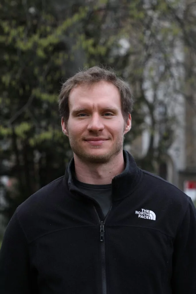 Man standing in front of a tree