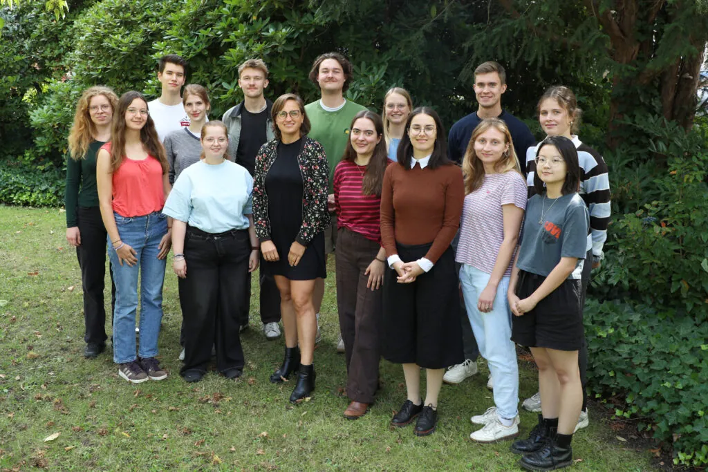 Group of 14 people mixed women and men standing